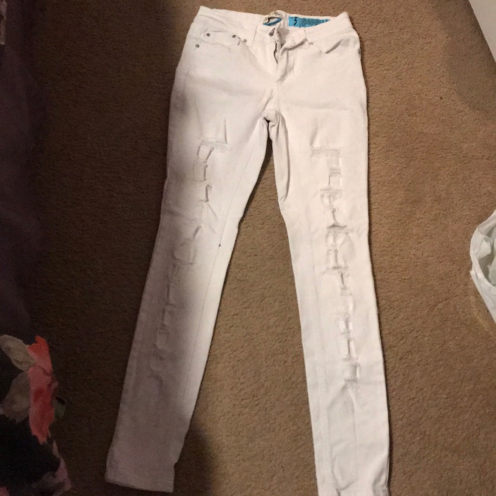 White ripped distressed jeans.
